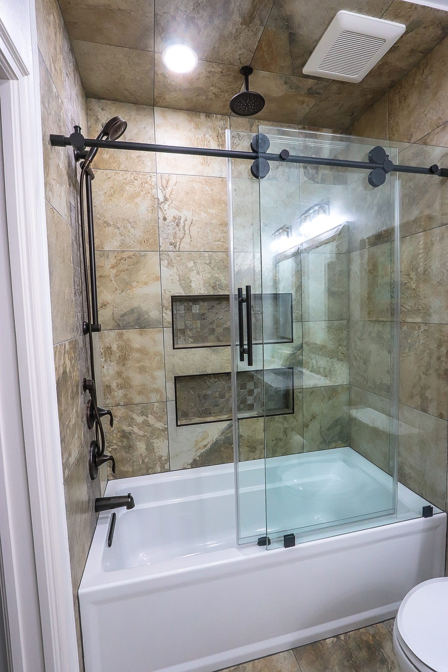 Modern bathroom with glass shower and white vanity