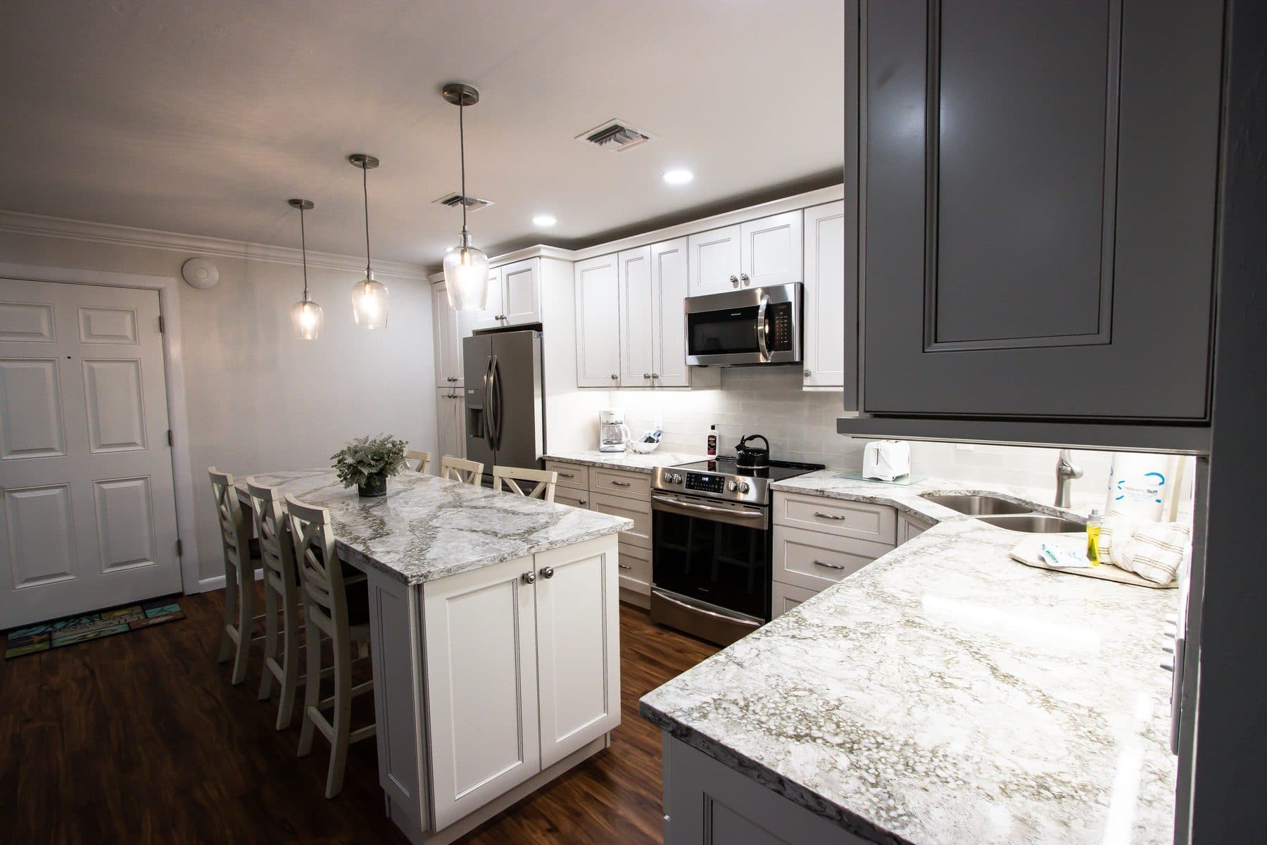 Finished white and gray kitchen with island seating