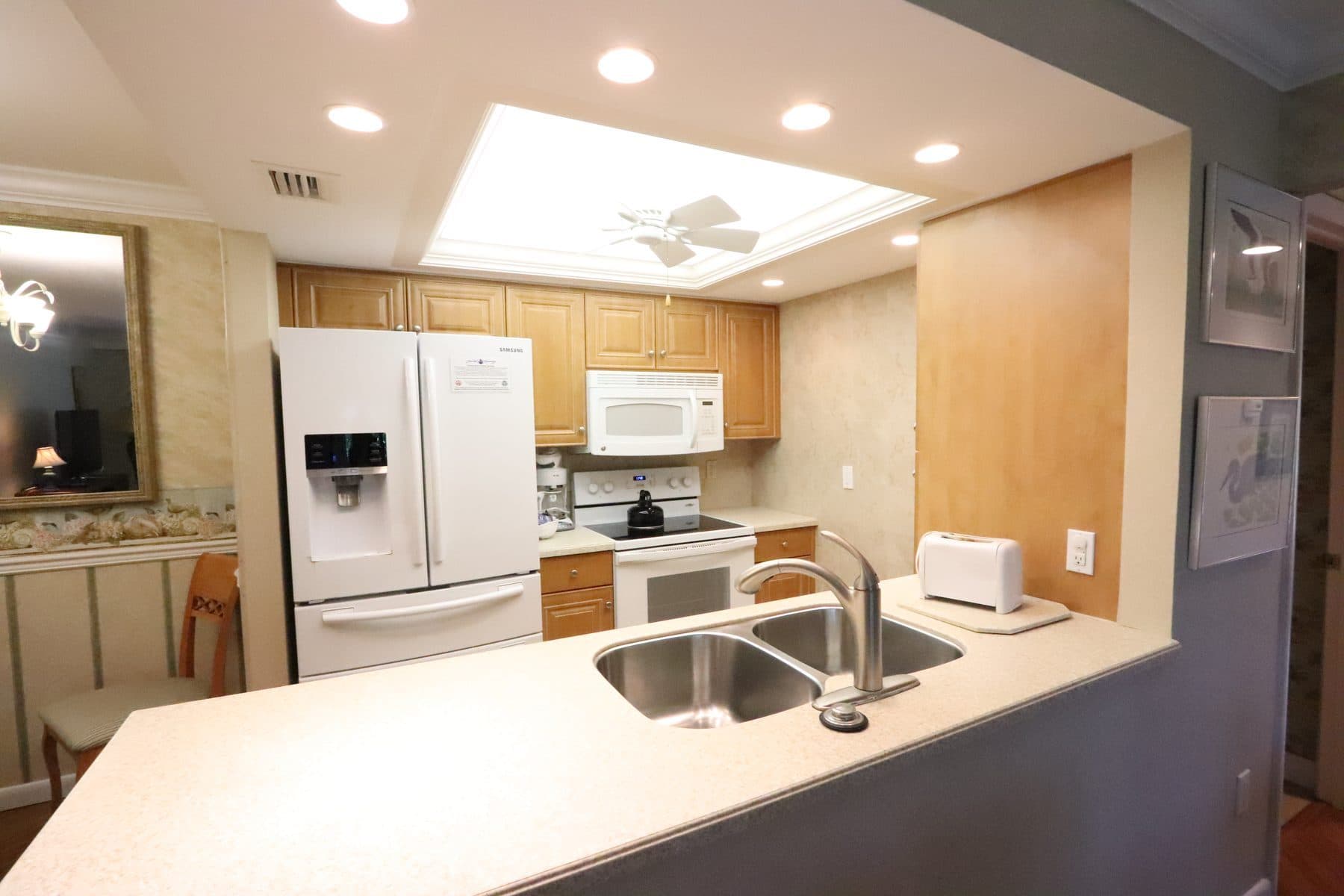 Dated kitchen with oak cabinetry