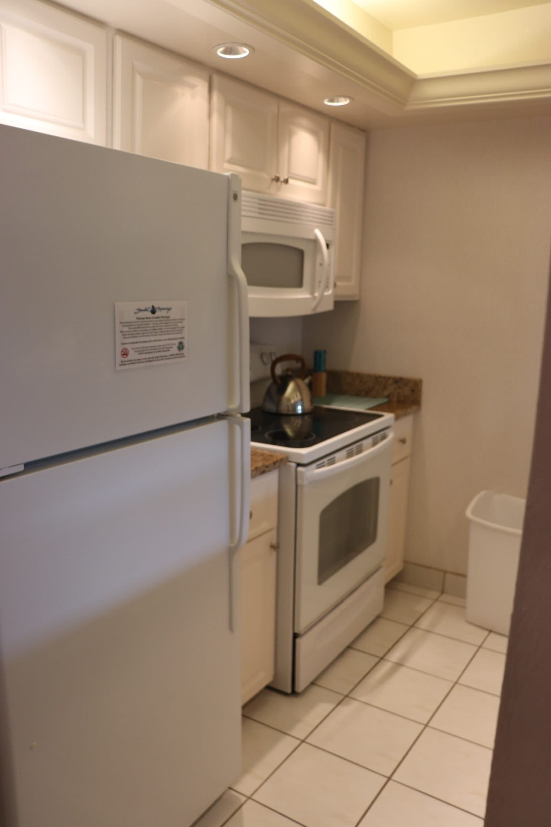 Dated kitchen with white appliances
