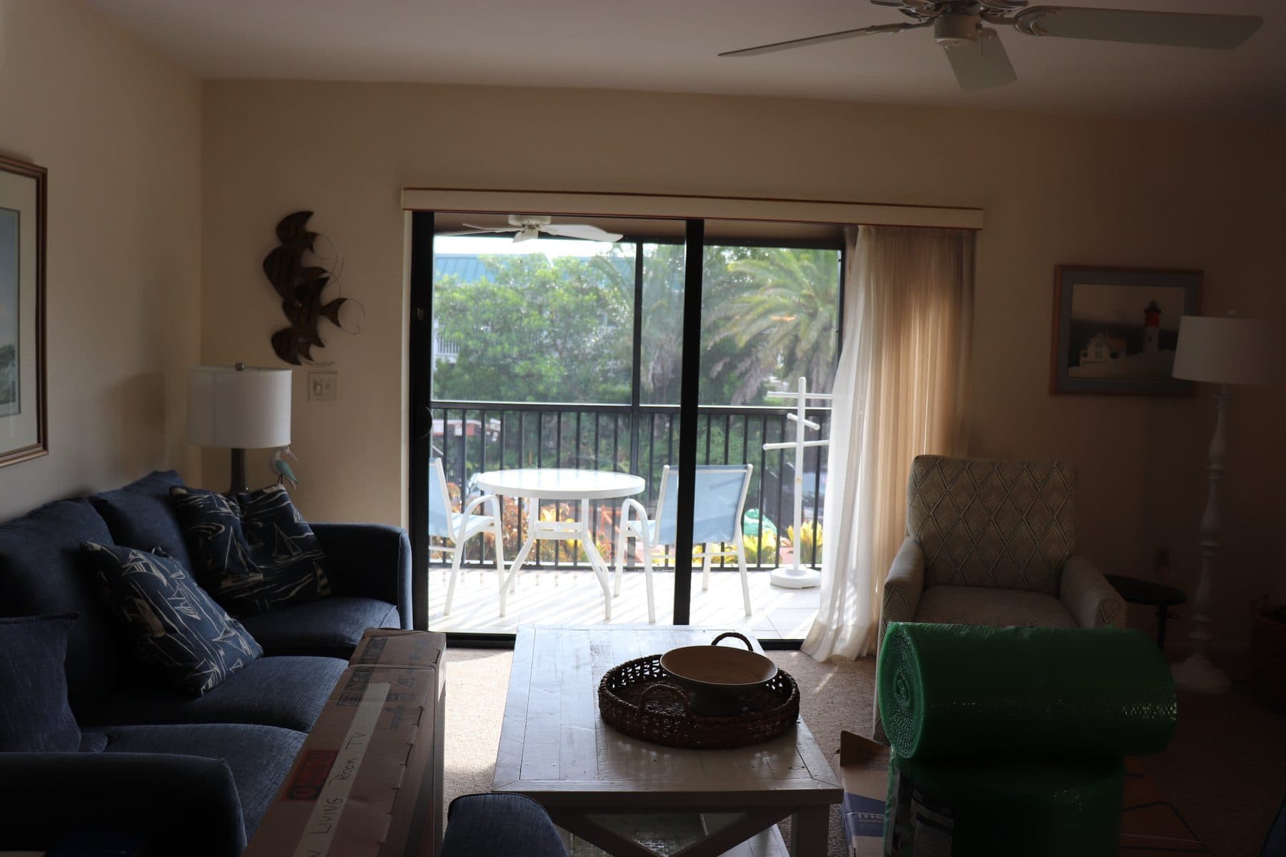Finished living room with balcony view