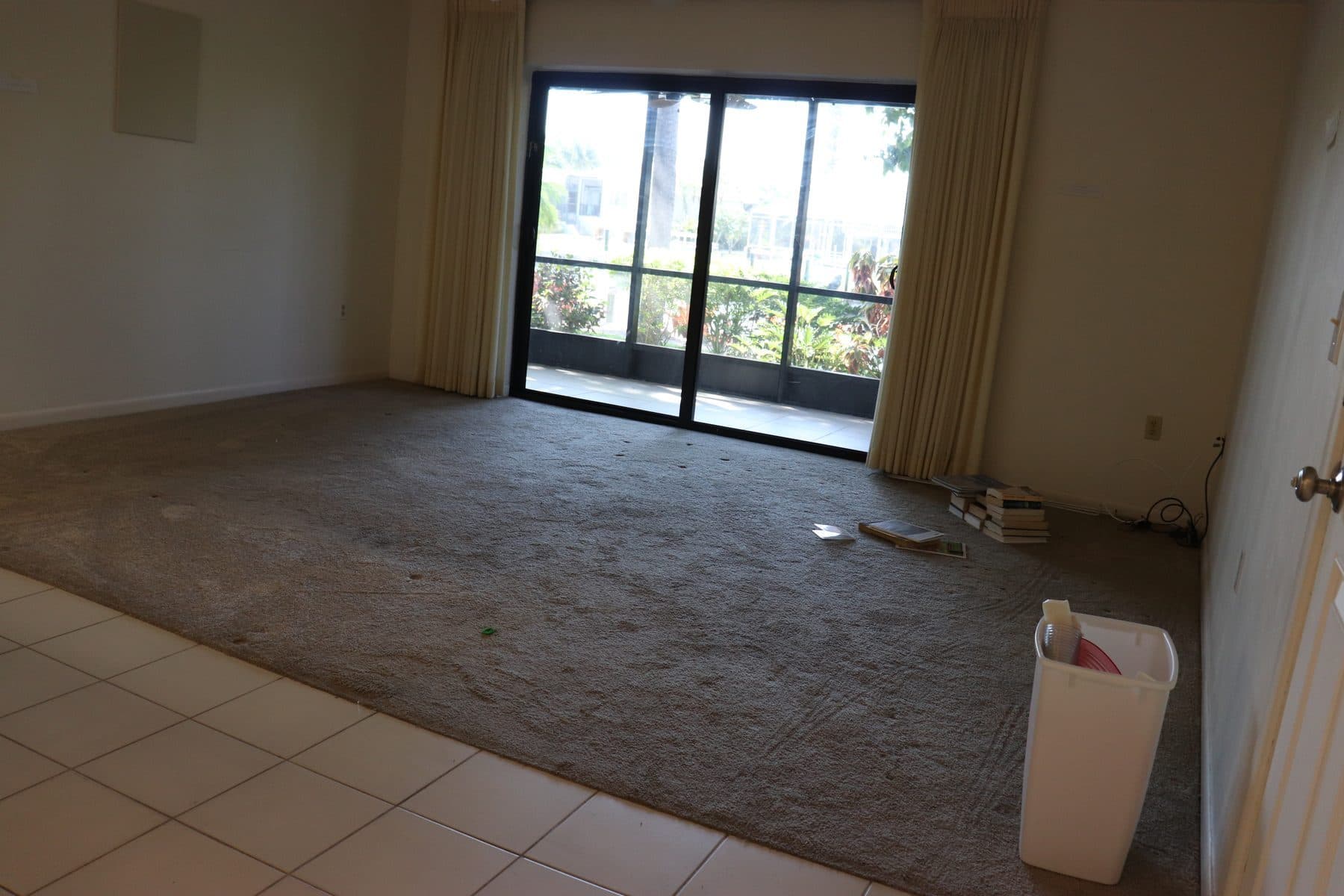Empty living room with sliding glass door