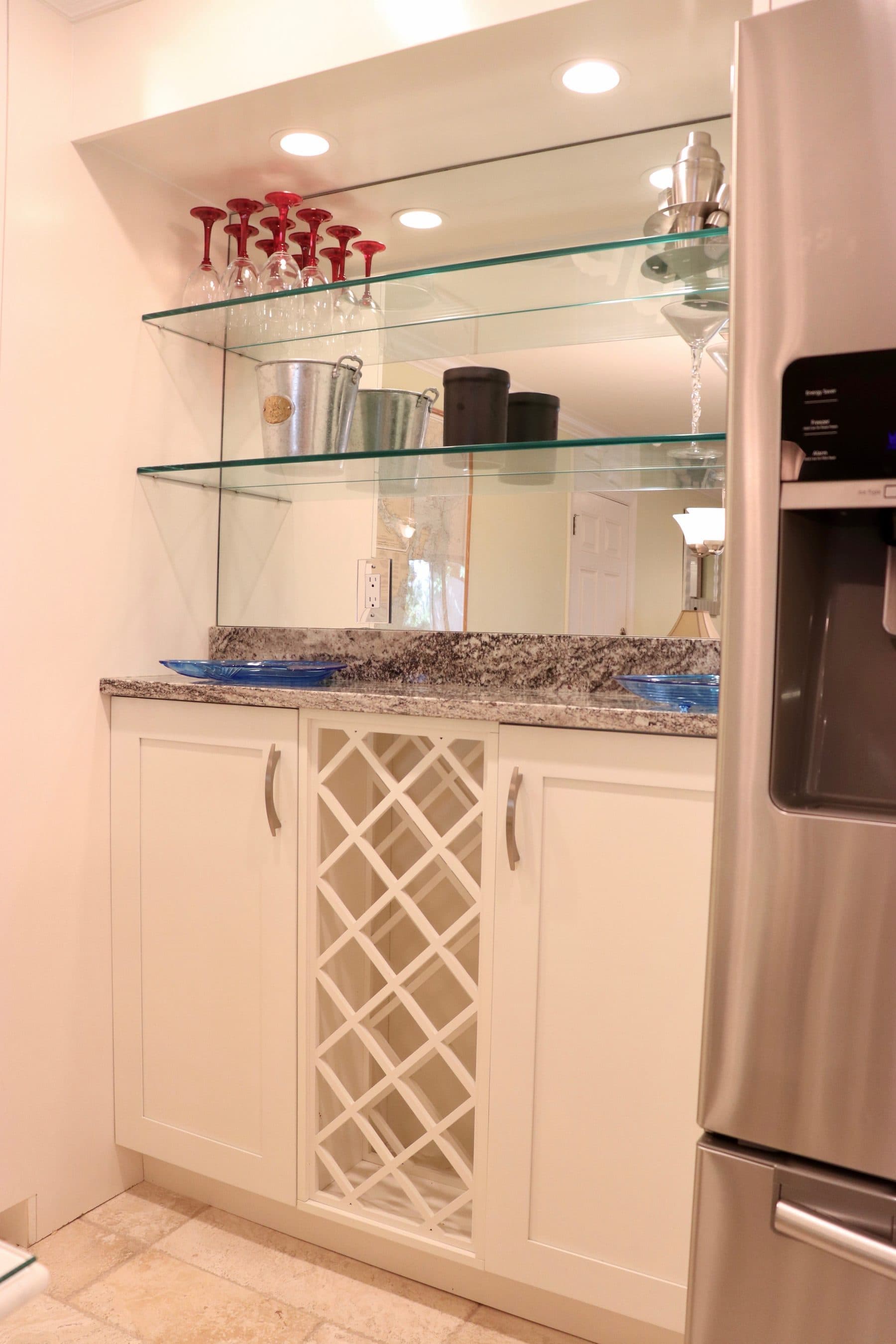 Built-in wet bar with glass shelving