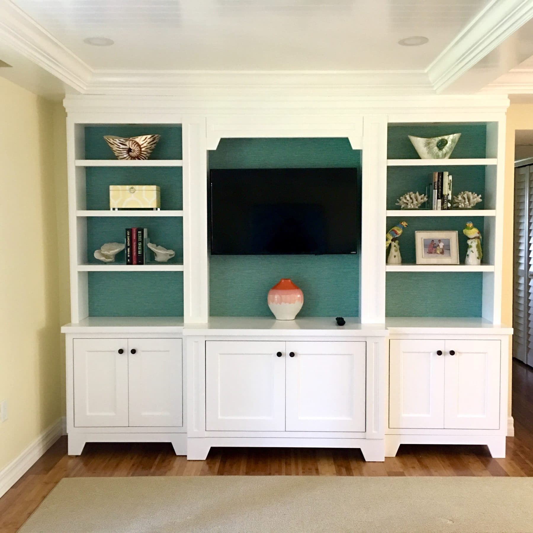 Built-in entertainment center with accent shelving