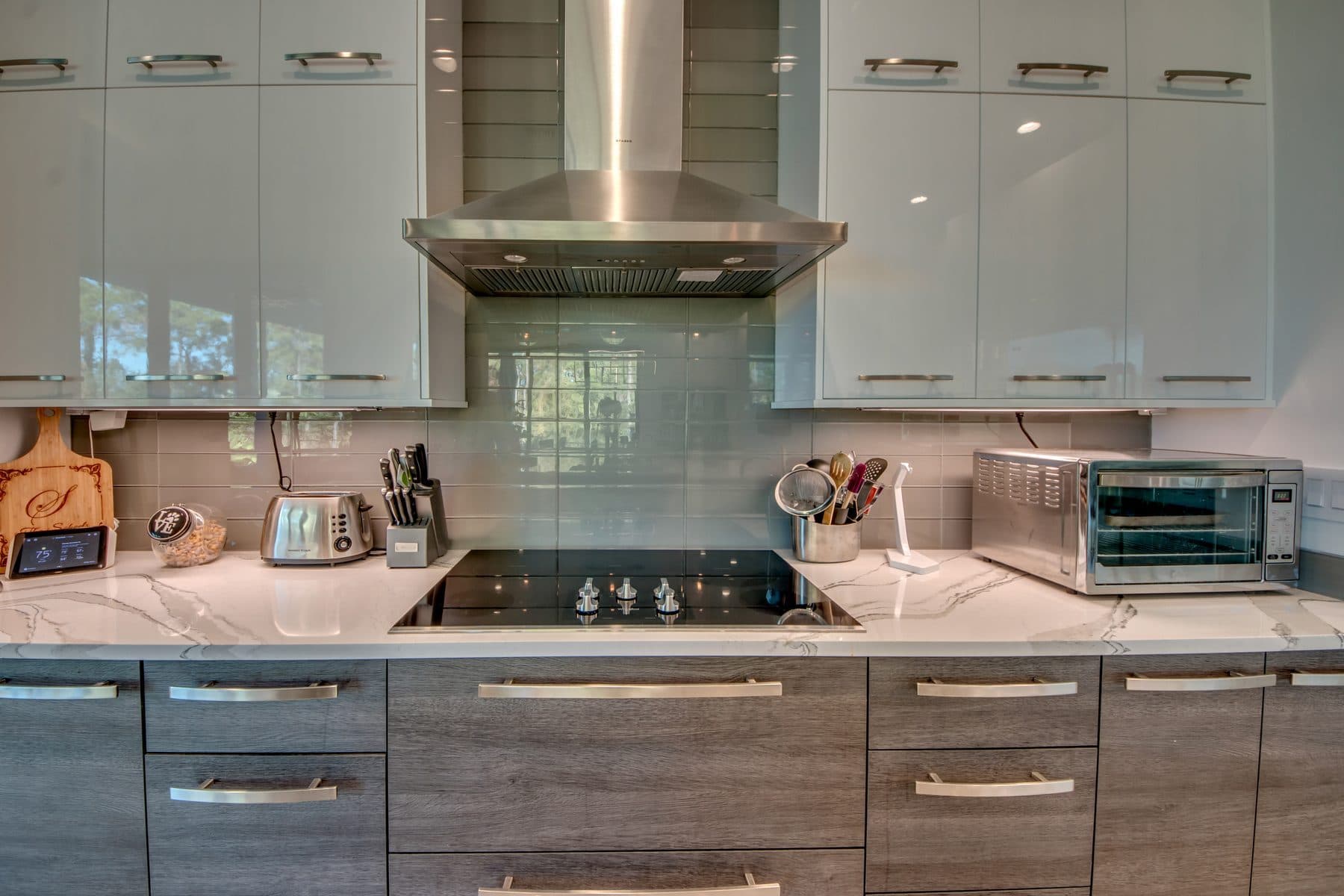 Kitchen with waterfall island and marble counters