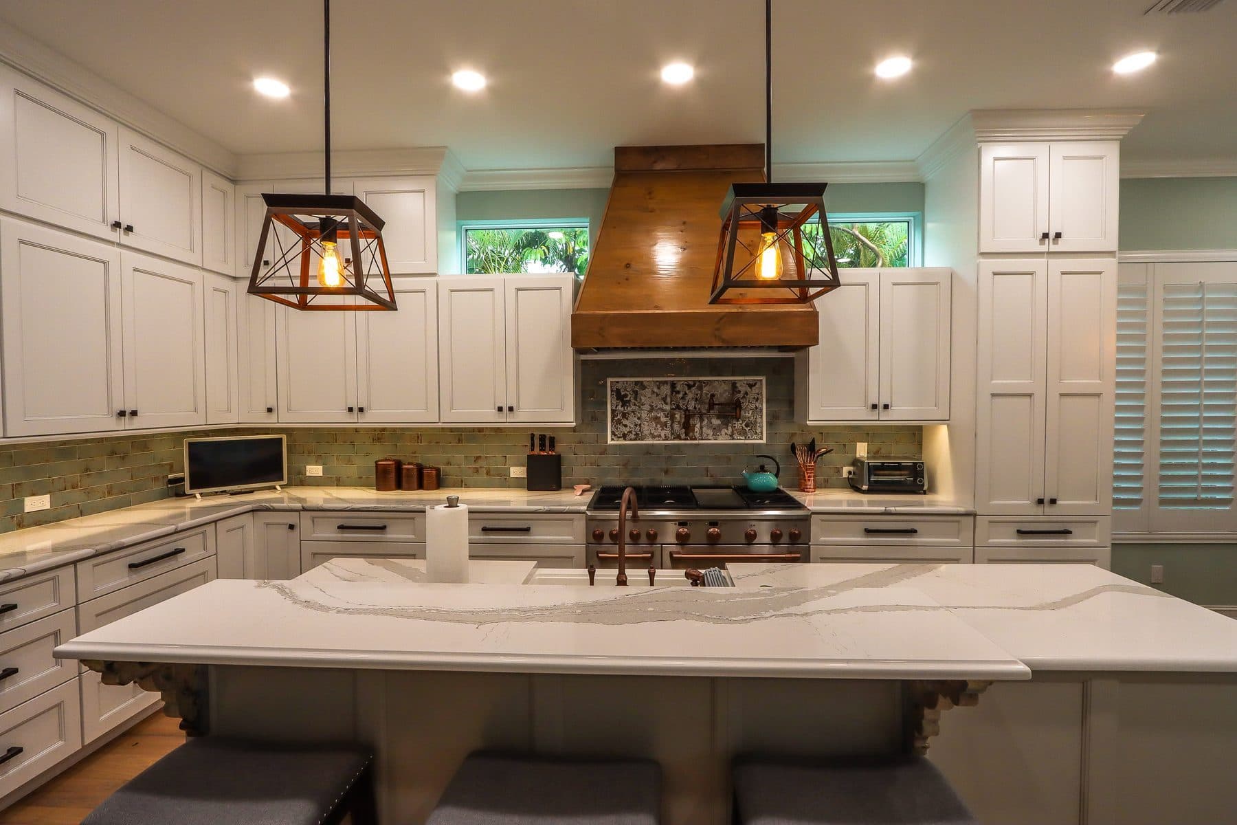 Farmhouse-style kitchen with wood range hood
