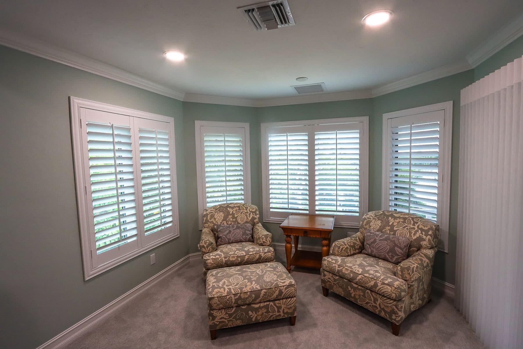 Living room with plantation shutters and seating