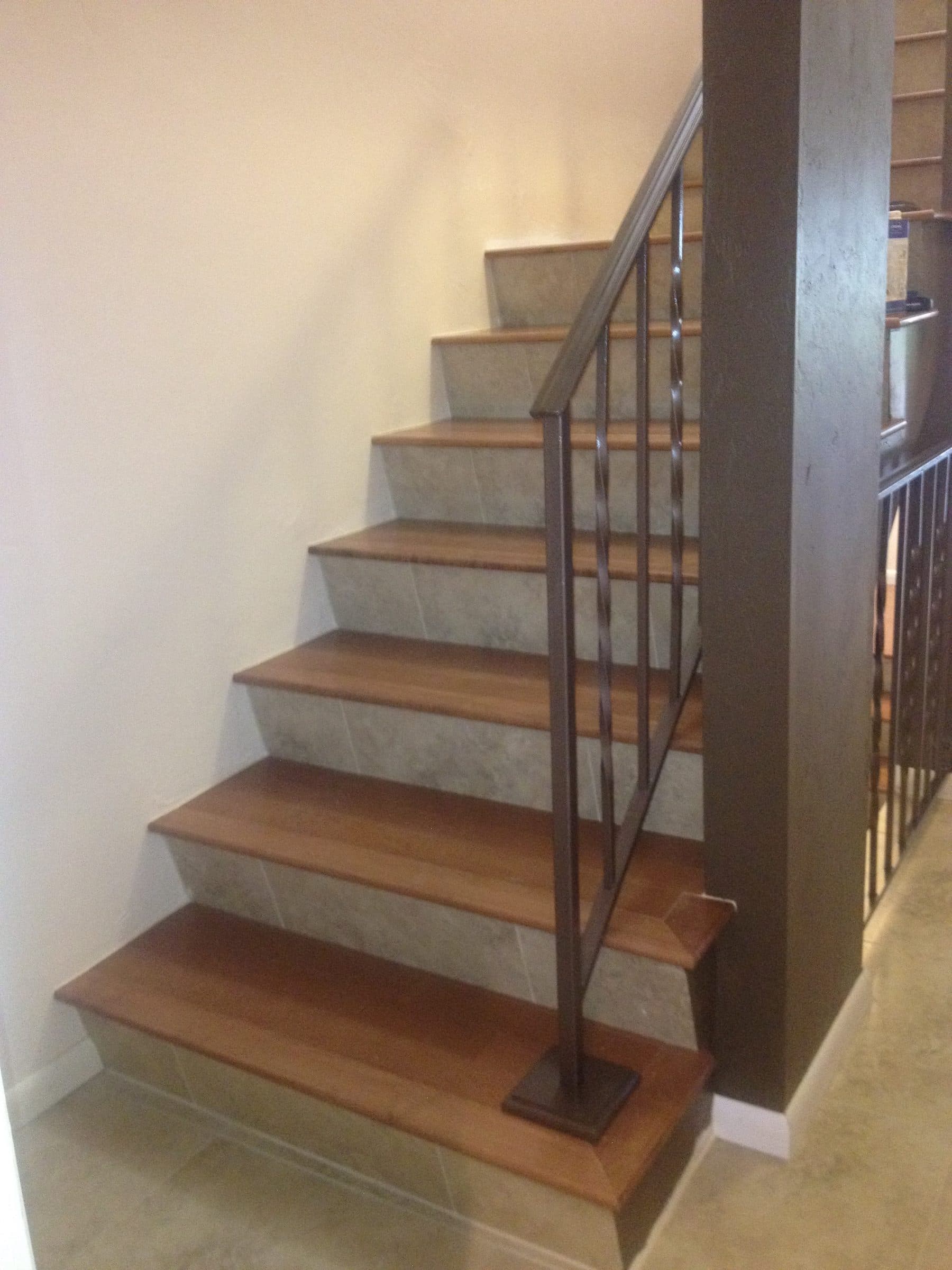 Modern staircase with glass and wire railing